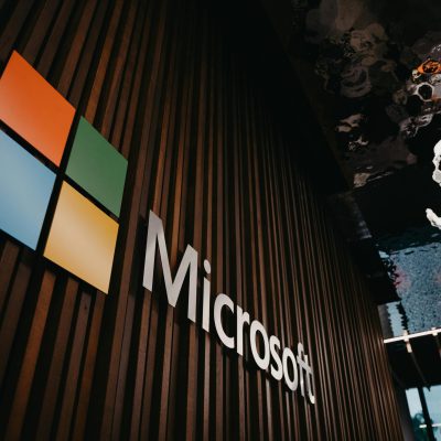 Interior view of Microsoft office with logo on wooden wall in Brussels, Belgium.